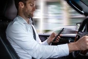 Man texting and driving