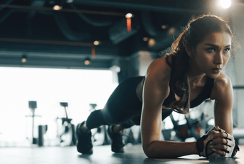 person doing planks at the gym