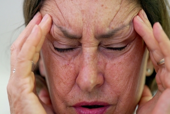 A senior woman stressed