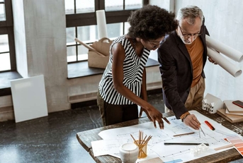 assistant of interior designer helping boss