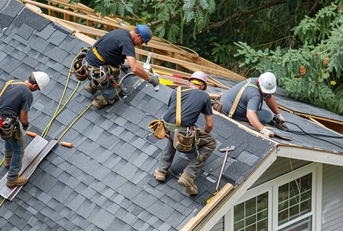Roofers installing new shingles on a house 