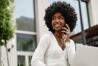 Smiling woman talking on phone