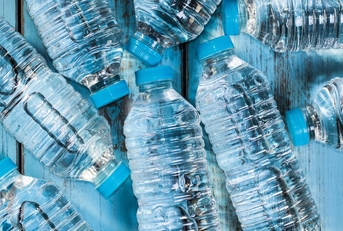 bottles of water on a wooden table