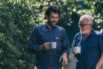father and son talking together