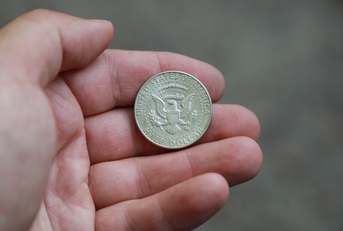 old coin half dollar in hand