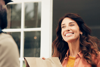 Woman getting a food delivery