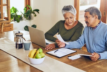 senior couple reading documents