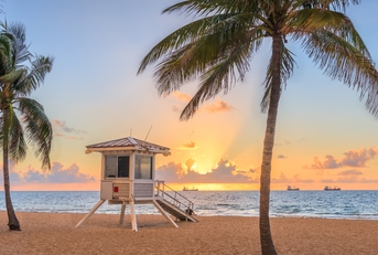 beach and life guard tower at sunrise