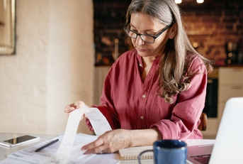 woman focused on computing finances
