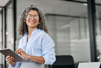 business woman holding tablet in office