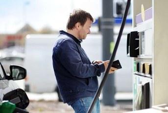 man filling gasoline fuel