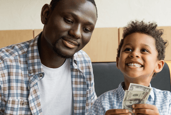 Father and son depositing cash