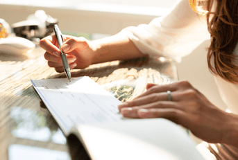person signing check