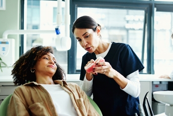 dentist explaining to her patient