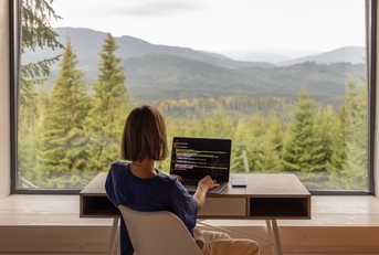 woman working remotely with picturesque view