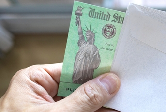 a person holding a us treasury tax refund