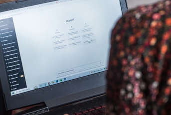 Illustrative editorial of a woman on laptop