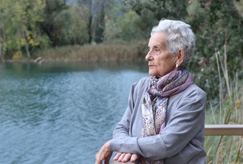 senior woman on the side of river