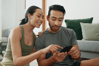 Couple looking at phone