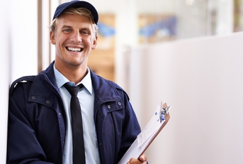 Postal service worker smiling