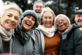 group of smiling retirees outdoors