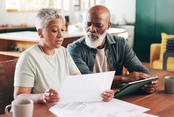 senior couple reviewing documents