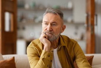 Portrait of thoughtful senior man looking away