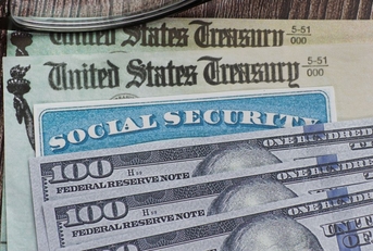social security card check and hundred dollar bills
