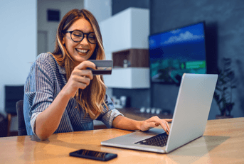 Woman with laptop and credit card