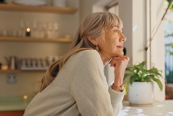 woman thinking at home for retirement
