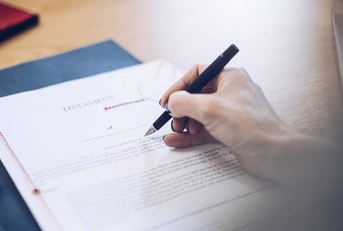 A will is signed by a female notary