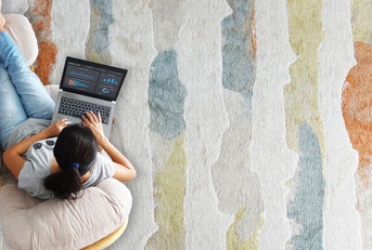 woman working remotely in living room