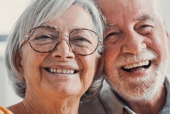 close up of smiling retired couple