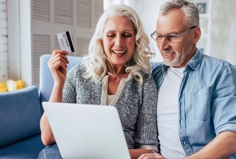 Older couple shopping online