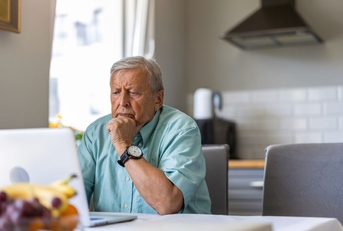 elderly man on laptop