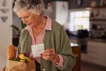 older woman with groceries
