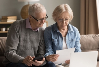 older couple doing paperwork