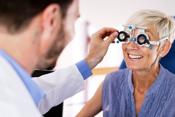 older woman getting eye exam