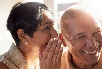 Elderly people sharing a secret