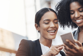Friends looking at cell phone