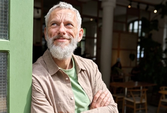 68 year old man at a cafe