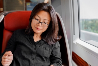 Asian woman riding the train