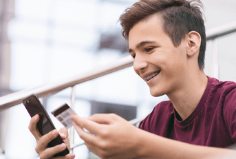 Teen boy with credit card