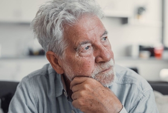 Portrait of a retired man looking concerned