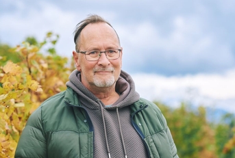 Portrait of a man in his 60s outdoors during autumn
