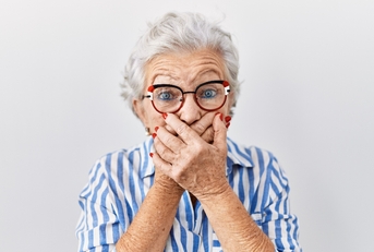 A surprised senior woman