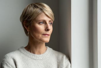 Thoughtful looking woman in her 50s