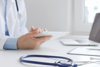 Doctor's office with a stethoscope in the foreground