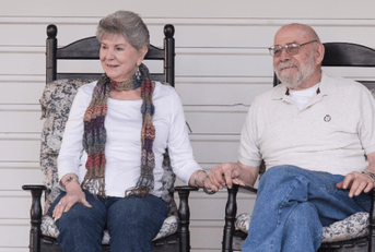 Older couple sitting on porch 2