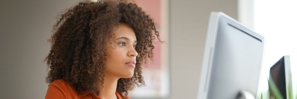 Woman looking at a computer